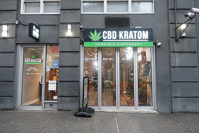 A shopfront with the name, "CBD KRATOM, Cannabis dispensary".